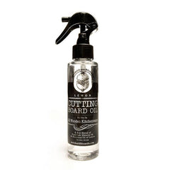 Black spray bottle of cutting board oil.