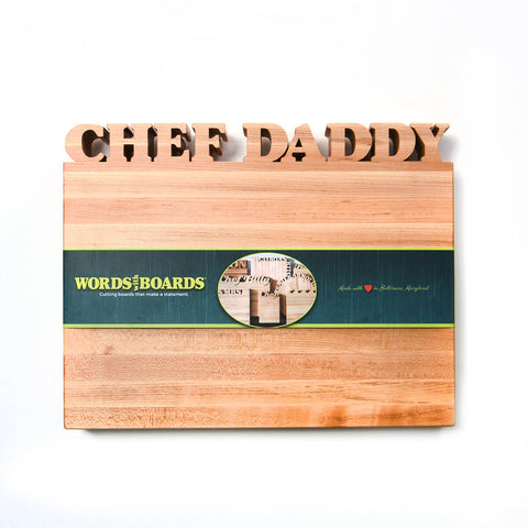 Rectangle Maple Cutting Board with word Chef Daddy cut out along the top. Green paper Words with Boards band across the center.